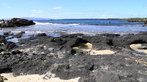 Hawaii waves on lava flow with dive boat Stock Footage 33871144