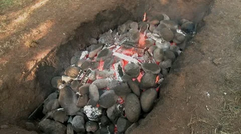 Hawaiian Imu pit fire overview Stock Footage 9090932