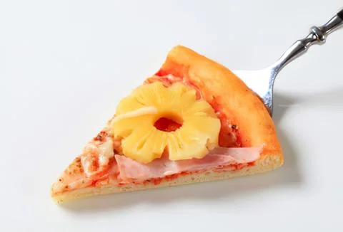 Hawaiian pizza slice with pineapple on fork Stock Photos