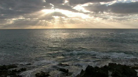 Hawaiian sunset rays rocks ocean Hawaii M HD Stock Footage