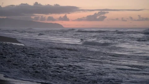 Hawaiian waves crashing on beach at sunset Honolulu Hawaii Stock Footage 313157341