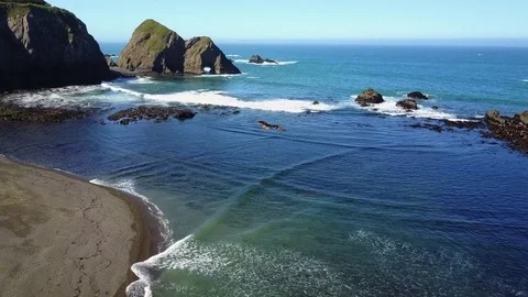 Hawk flying over the beach at Elk Cove in Elk, California Stock Footage 75733081