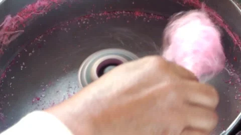 A hawker making sweet cotton candy. Stock Footage 338240041