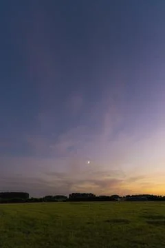Hay bale at sunset in a field Stock Photos
