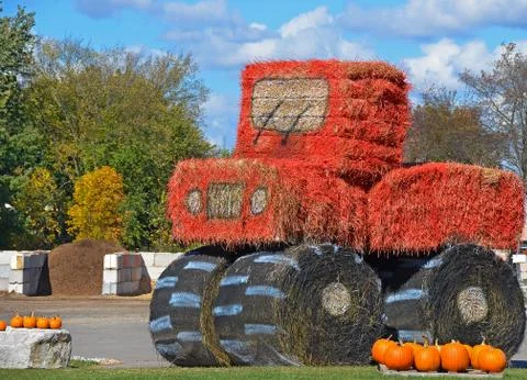 Hay bale tractor Stock Photos