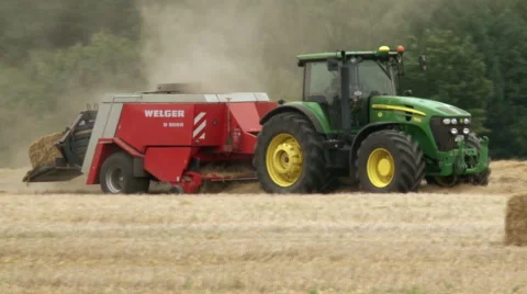 Hay baler producing rectangular straw bales from rye straw Video stock 59119567
