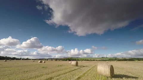 Hay bales with passing clouds Stock Footage 152815512