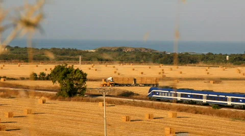 Hay field. Train passing by the field. Stock Footage 760693