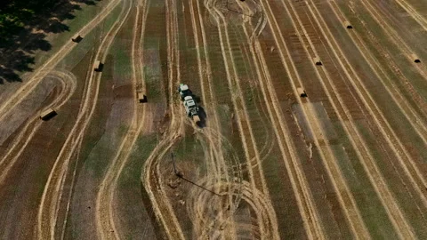 Hay making in field. Tractor with round baler. Stock Footage 218389863