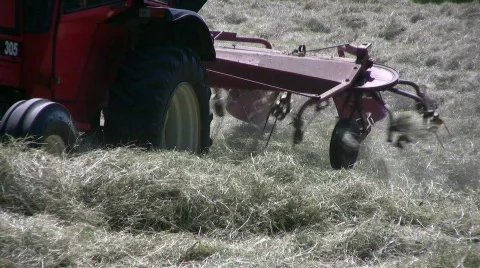 Hay racking with a tractor Stock Footage 489104