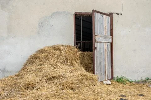 The hayloft. a haystack in the barn door Stock Photos