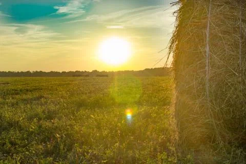 Haystack on the background of beautiful sunset Stock Photos