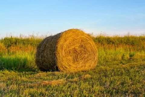 Haystack on the background of beautiful sunset Stock Photos