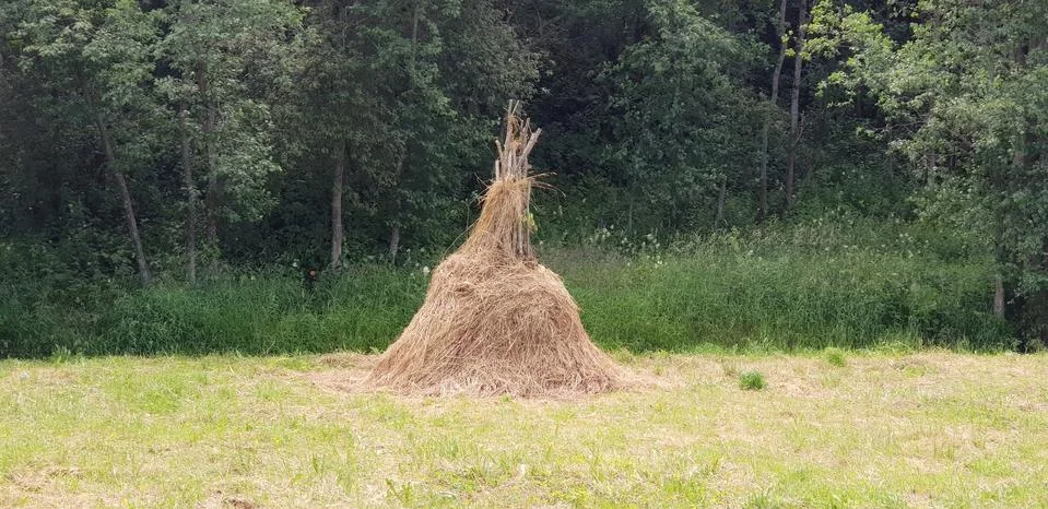 Haystack at the edge of the forest Stock Photos