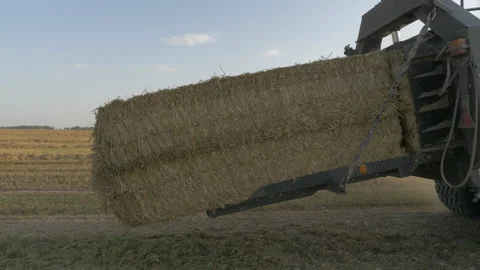 A haystack falls out of the combine Stock Footage 141796983