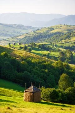 Haystack on the grassy hill Stock Photos