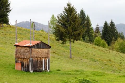 Haystack  on a green  meadow in the mountains Stock Photos