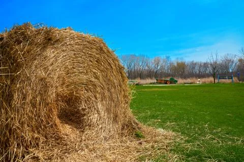 Haystack in Park with green grass and blue skies. Фото