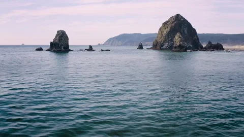 Haystack Rock basalt sea stack formation... | Stock Video | Pond5