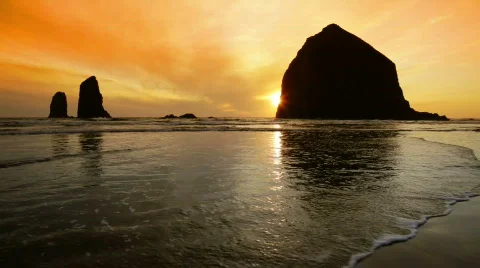 Haystack Rock in Cannon Beach on Oregon Coast, sunset Stock Footage 713186