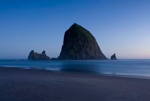 Haystack rock at night Stock Photos