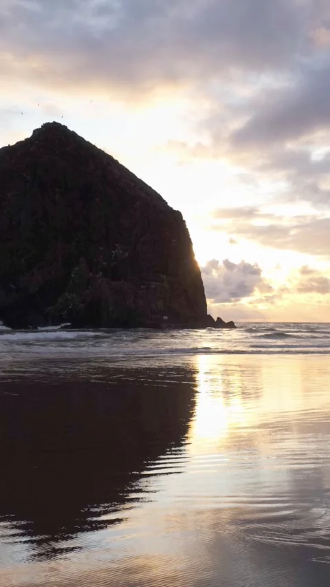 Haystack Rock sunset aerial loop, Cannon Beach, Oregon Stock Footage 345109626