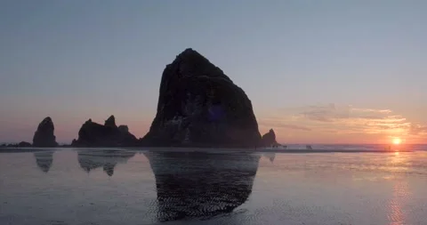 Haystack rock with sunset, Cannon Beach, Oregon - 4K Nature Stock Footage 231092447