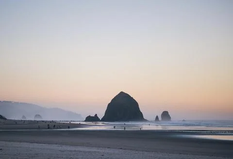 Haystack Rock At Sunset on Cannon Beach, Oregon Stock Photos