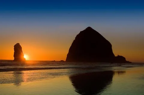 Haystack Rock at Sunset Stock Photos