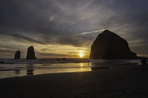 Haystack Rock at Sunset Stock Photos