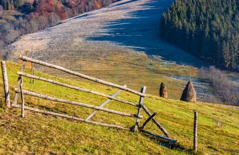 Haystack on the rural field on hillside Stock Photos
