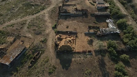 Haystack in the yard of a farm in the desert Stock Footage 223539569