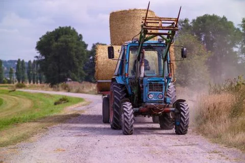 Haystacks on tractor Stock Photos