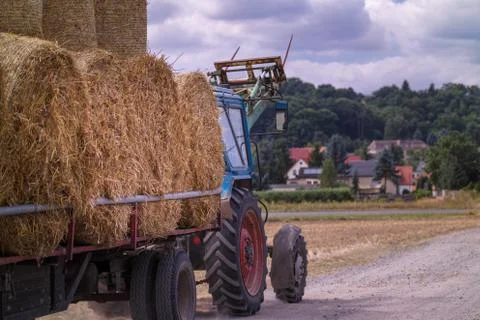 Haystacks on tractor Stock Photos