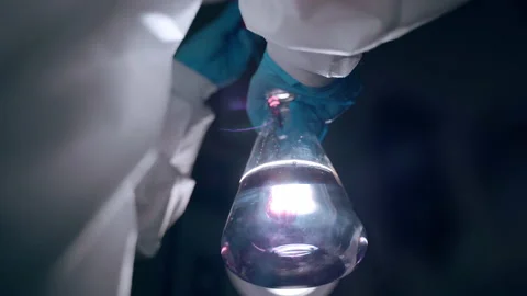Hazard experiments in researching laboratory, close-up of glass beaker with Stock-Footage 143879417