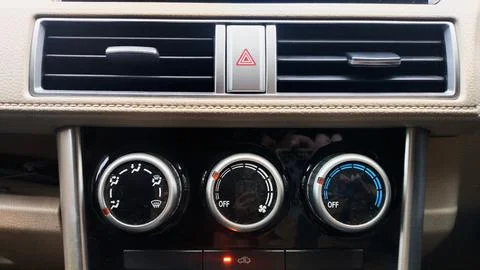Hazard light button and the AC setting control Stock Photos