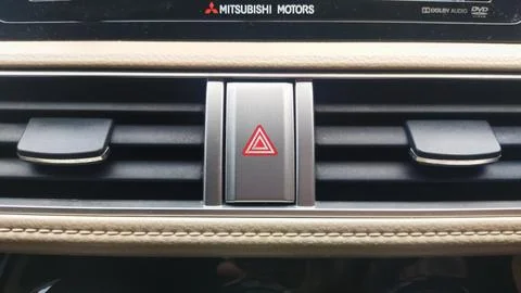 Hazard light button between the AC vents Stock Photos