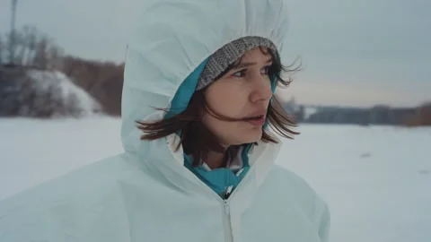 Hazard suit scientist examines icy shoreline. Environmental surveyor in 動画素材 342741191