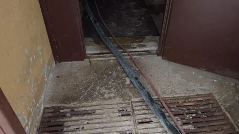 Hazardous elevator platform with unsecured cables and debris threatening safety Stock Footage 328734570