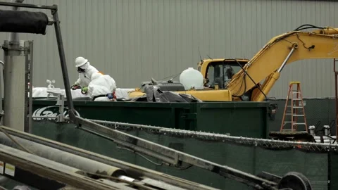 Hazardous Materials Workers In Dumpster Stock Footage 234083913