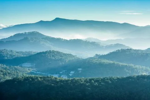 Haze and rays light in the mountains landscape Stock Photos