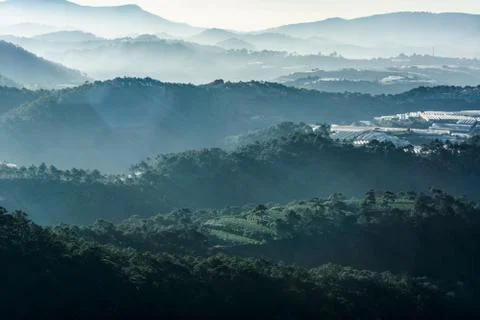 Haze and rays light in the mountains landscape Stock Photos