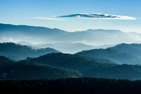 Haze and rays light in the mountains landscape Stock Photos