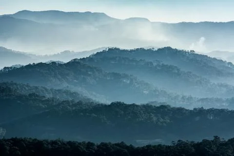 Haze and rays light in the mountains landscape Stock Photos