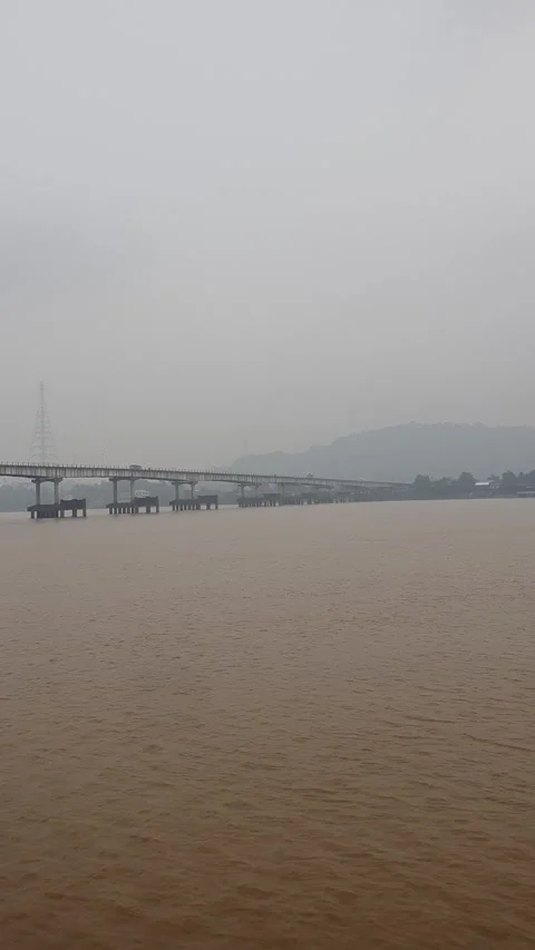 Haze and thick smoke from forest fires blanketing a river in West Kalimantan Video stock 345693380