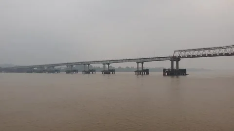Haze and thick smoke from forest fires blanketing a river in West Kalimantan Video stock 345693428