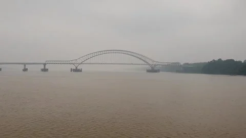 Haze and thick smoke from forest fires blanketing a river in West Kalimantan Video stock 345693445