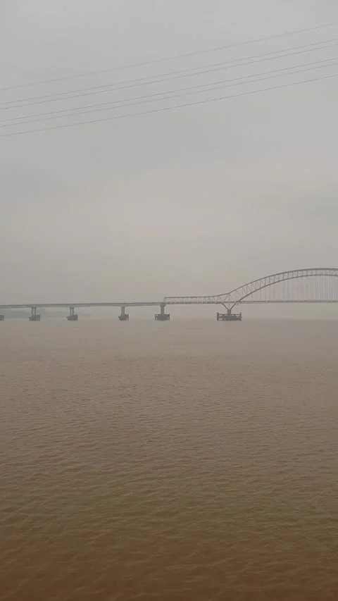 Haze and thick smoke from forest fires blanketing a river in West Kalimantan Video stock 345693527