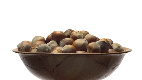 Hazel nuts in nutshell. Rotation. Closeup. Selective focus. Isolated on white. Stock Footage 101545791