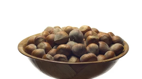 Hazel nuts in nutshell. Rotation. Closeup. Selective focus. Isolated on white. Stock Footage 101550941